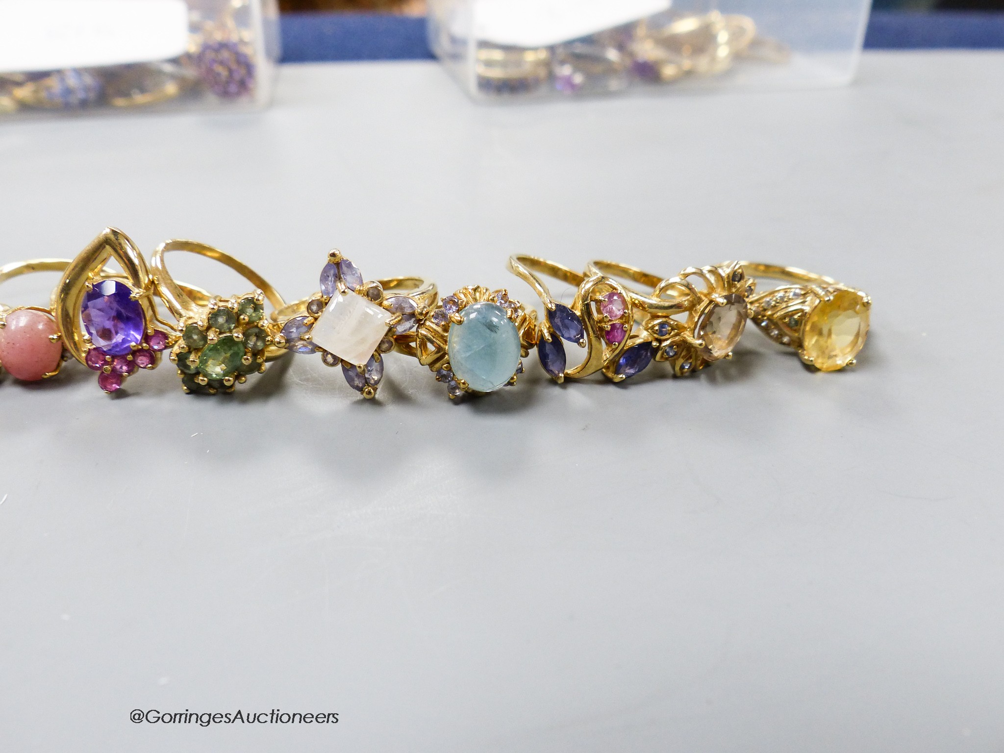 Fourteen assorted modern 10k yellow metal and gem set dress ring, gross 41.9 grams.